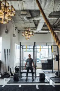 Guy in the gym ready to deadlift some serious weight with city buildings in the background